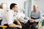 Elderly male patient with doctor