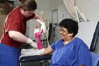 Female having arm put in plaster Female having arm put in plaster