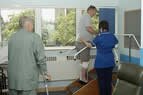 Male patients exercising after surgery