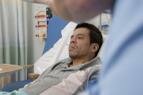 Male patient having temperature taken