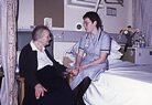 Elderly female patient with nurse. 